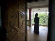 A Catholic nun stands at the foyer of the St. Francis Mission Home in Kuravilangad in the southern Indian state of Kerala. For decades, nuns in India have quietly endured sexual pressure from Catholic priests, an AP investigation has revealed.