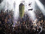 A depiction of a cannabis bud drops from the ceiling on Oct. 17 at Leafly’s countdown party in Toronto as midnight passes and marks the first day of the legalization of cannabis across Canada.