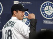 Seattle Mariners pitcher Yusei Kikuchi smiles and shows off his new jersey following a news conference after his signing with the team, Thursday, Jan. 3, 2019, in Seattle. Kikuchi is the latest Japanese star to decide on calling Seattle home in the majors. The Mariners hope their new left-handed pitcher can help in their rebuild process.