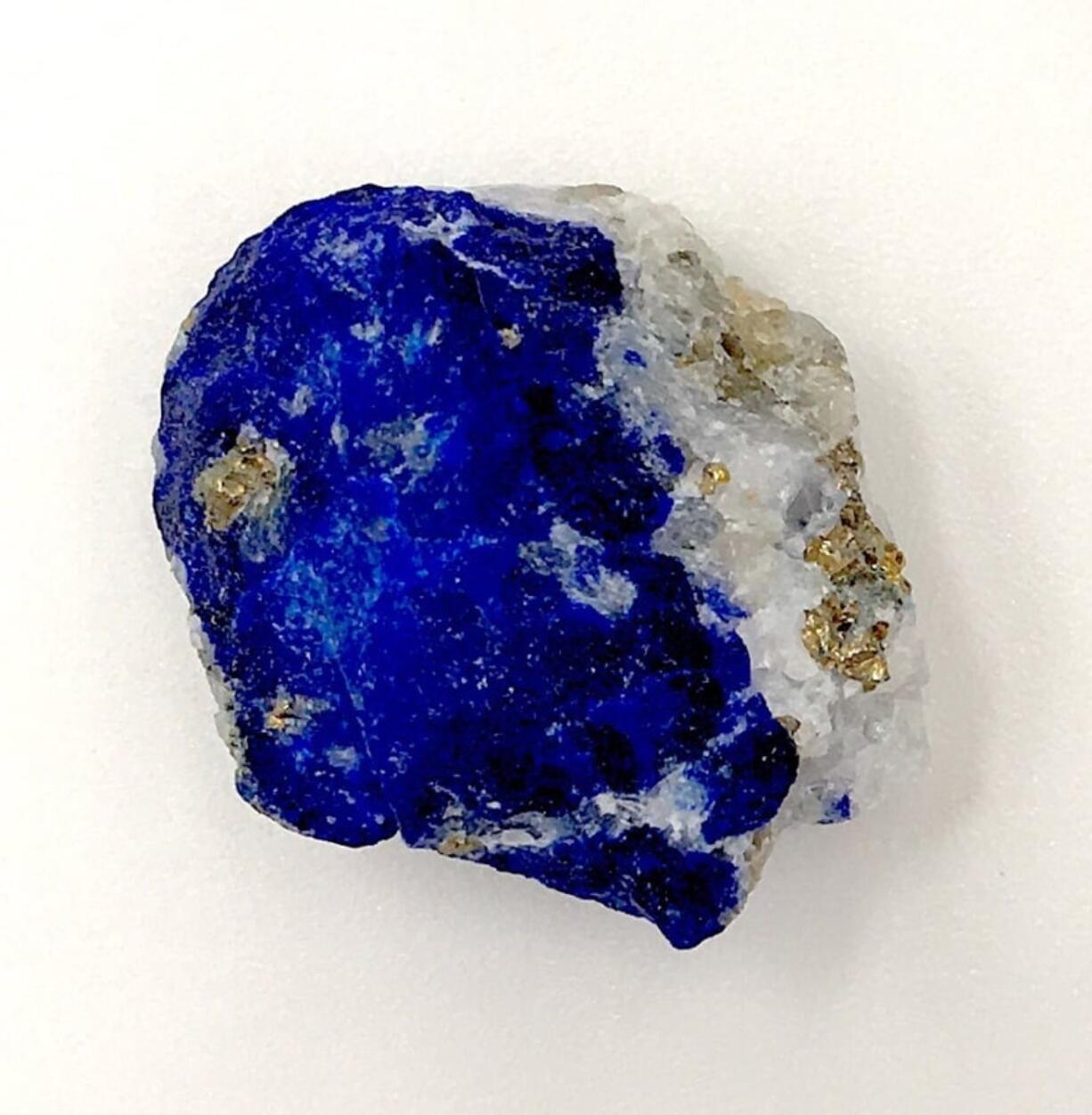 This undated photo released by the Max Planck Institute for the Science of Human History in Jena, Germany, shows a piece of lapis lazuli. During the European Middle Ages, Afghanistan was the only known source of the rare blue stone which at the time was ground up and used as a pigment. Modern-day scientists who examined the 1,000 year-old remains of a middle-aged woman in Germany discovered the semi-precious stone in the tartar on her teeth. From that, they concluded the woman was an artist involved in creating illuminated manuscripts, a task usually associated with monks. The find is considered the most direct evidence yet of a woman taking part in the making of high-quality illuminated manuscripts, the lavishly illustrated religious and secular texts of the Middle Ages. And it corroborates other findings that suggest female artisans were not as rare as previously thought.