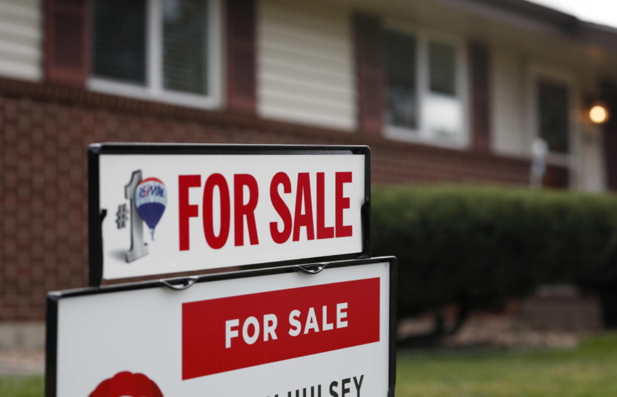 FILE- In this Oct 2, 2018, file photo a for sale sign stands outside a home on the market in the north Denver suburb of Thornton, Colo. Entry-level homes are hard to find. As a homebuyer, you can broaden your search by considering homes in need of improvement.