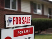 FILE- In this Oct 2, 2018, file photo a for sale sign stands outside a home on the market in the north Denver suburb of Thornton, Colo. Entry-level homes are hard to find. As a homebuyer, you can broaden your search by considering homes in need of improvement.