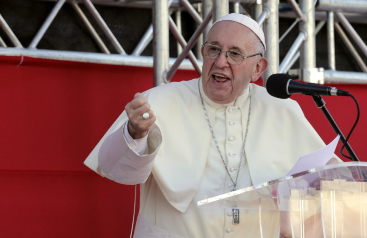 Pope Francis speaks to volunteers who worked at the World Youth Day event, before his departure in Panama City, Sunday, Jan. 27, 2019.