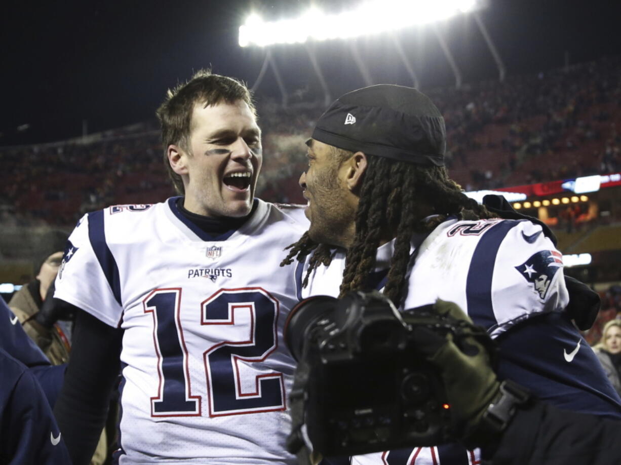 New England Patriots quarterback Tom Brady (12) celebrates with cornerback Stephon Gilmore (24) after defeating the Kansas City Chiefs in the AFC Championship NFL football game, Sunday, Jan. 20, 2019, in Kansas City, Mo.