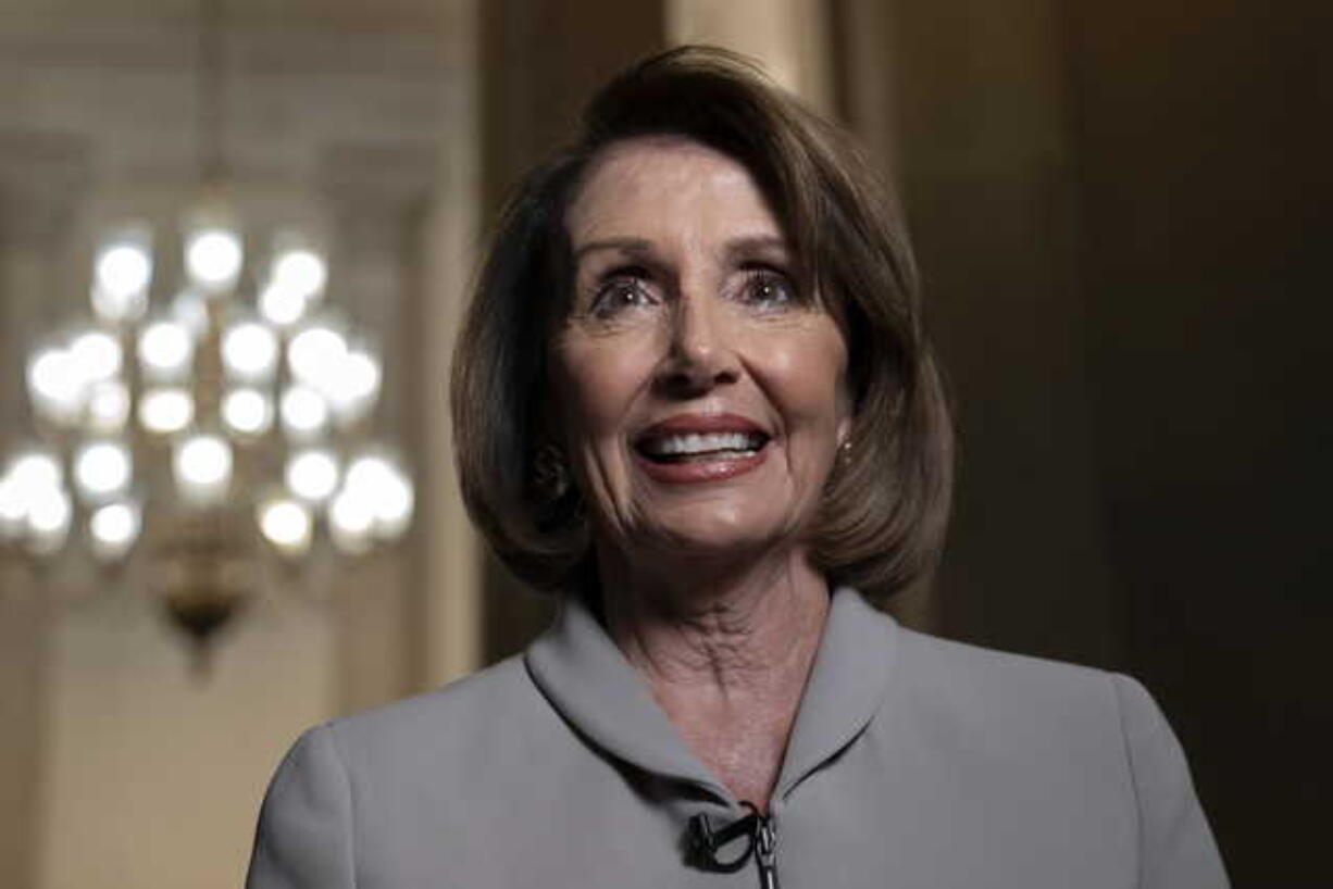 House Democratic Leader Nancy Pelosi of California, who will become speaker of the House on Jan. 3, walks to her new office at the Capitol during a television interview, in Washington, Wednesday, Jan. 2, 2019. The Republicans will relinquish the majority to House Democrats under the leadership of Nancy Pelosi beginning a new era of divided government. (AP Photo/J.