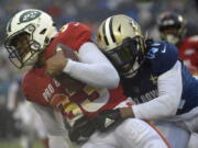 AFC safety Jamal Adams (33), of the New York Jets, is stopped by NFC running back Alvin Kamara (41), of the New Orleans Saints, after intercepting a pass during the second half of the NFL Pro Bowl football game Sunday, Jan. 27, 2019, in Orlando, Fla.