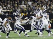 Los Angeles Rams players celebrate after overtime of the NFL football NFC championship game against the New Orleans Saints, Sunday, Jan. 20, 2019, in New Orleans. (AP Photo/David J.