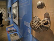 In this Tuesday, Jan. 29, 2019 photo, a glove used by Brooklyn Dodgers baseball player Jackie Robinson is displayed at the exhibit “In the Dugout with Jackie Robinson: An Intimate Portrait of a Baseball Legend” at the Museum of City of New York in New York. The 100th anniversary of Robinson’s birth is celebrated Thursday, Jan. 31, with the opening of the exhibit.