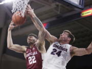 Santa Clara forward Josh Martin (22) and Gonzaga forward Corey Kispert (24) go after a rebound during the first half of an NCAA college basketball game in Spokane, Wash., Saturday, Jan. 5, 2019.