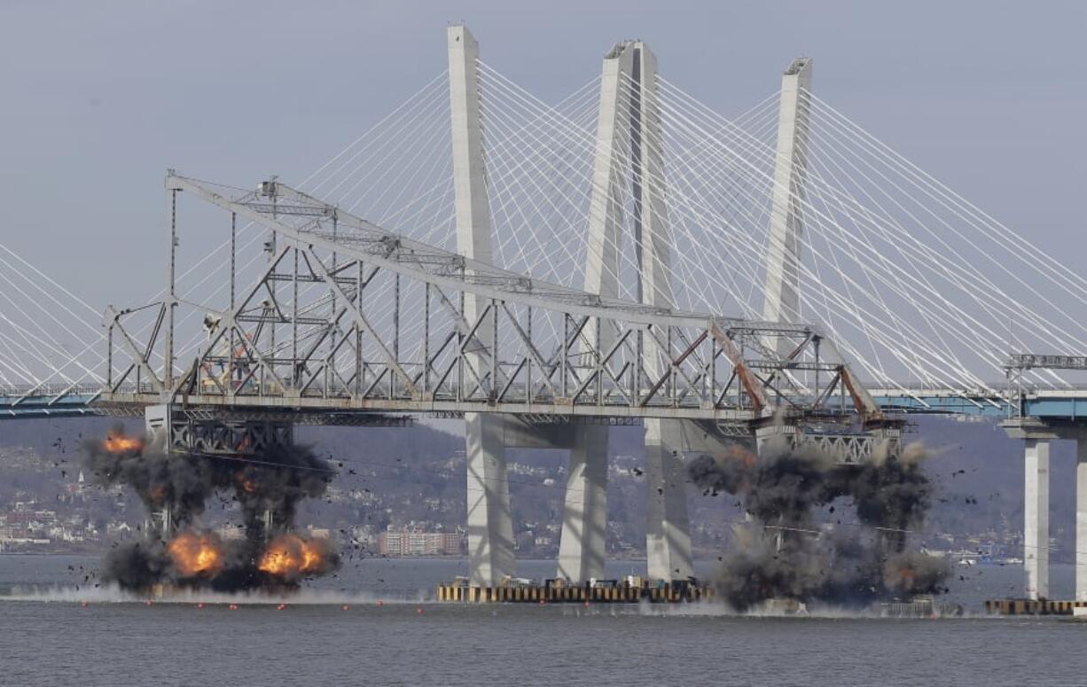 A section of the old Tappan Zee Bridge is brought down with explosives in this view from Tarrytown, N.Y., Tuesday, Jan. 15, 2019.