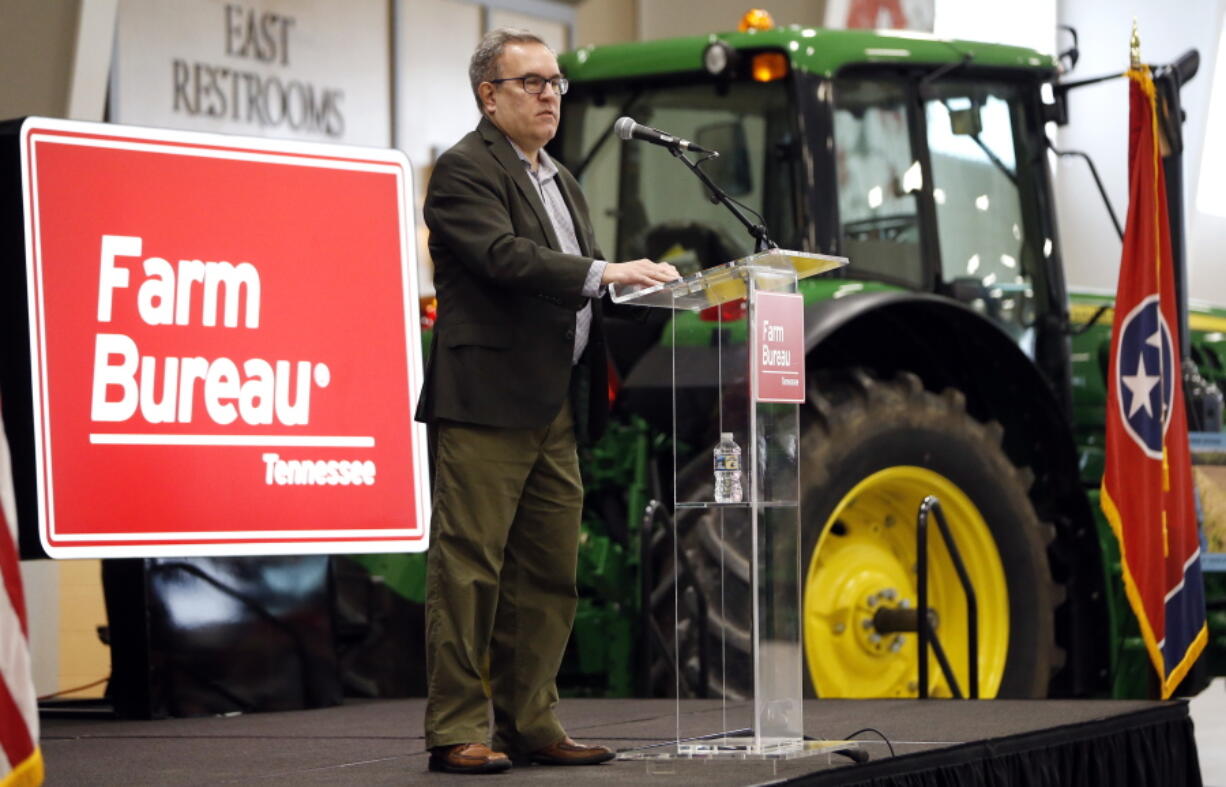 FILE - In this Tuesday, Dec. 18, 2018, file photo, acting EPA administrator Andrew Wheeler speaks in Lebanon, Tenn. Wheeler and Agriculture Secretary Sonny Perdue met with farmers about a new Trump administration proposal to redefine “waters of the United States.” Trump often points to farmers as among the biggest winners from the administration’s proposed rollback of federal protections for wetlands and waterways across the country. But under longstanding federal law and rules, farmers and farm land already are exempt from most of the regulatory hurdles on behalf of wetlands that the Trump administration is targeting.