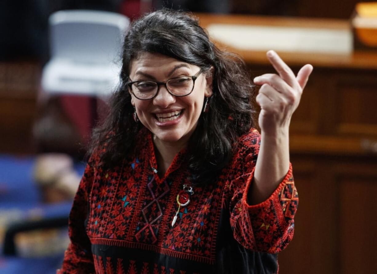 In this Thursday, Jan. 3, 2019 photo, then Rep.-elect Rashida Tlaib of Michigan, is shown on the house floor before being sworn into the 116th Congress at the U.S. Capitol in Washington. Tlaib exclaimed at an event late Thursday that Democrats were going to “impeach the mother------.” According to video and comments on Twitter, she apparently made the comments during a party hosted by the liberal activist group MoveOn.