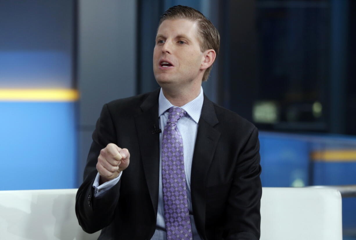 FILE - In this Jan. 17, 2018 file photo, Eric Trump appears on the “Fox & friends” television program, in New York. The Trump Organization, responding to claims that some of its workers were in the U.S. illegally, says it will use the E-Verify electronic system at all of its properties to check employees’ documentation. Executive Vice President Eric Trump said in a statement provided to The Associated Press on Wednesday, Jan.