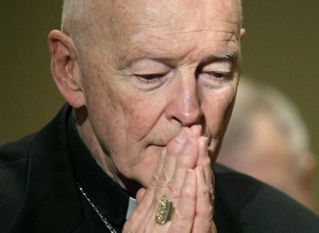 FILE - In this Nov. 14, 2011, file photo, then Cardinal Theodore McCarrick prays during the United States Conference of Catholic Bishops’ annual fall assembly in Baltimore. A lawyer says the key accuser in the sex abuse case against ex-Cardinal Theodore McCarrick has met with New York City prosecutors, evidence that the scandal that has convulsed the papacy is now part of the broader U.S. law enforcement investigation into sex abuse and cover-up in the Catholic Church.