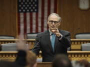 Gov. Jay Inslee takes questions from reporters following his speech Thursday at The Associated Press Legislative Preview at the Capitol in Olympia. The Legislature opens the 2019 session on Monday. (Ted S.