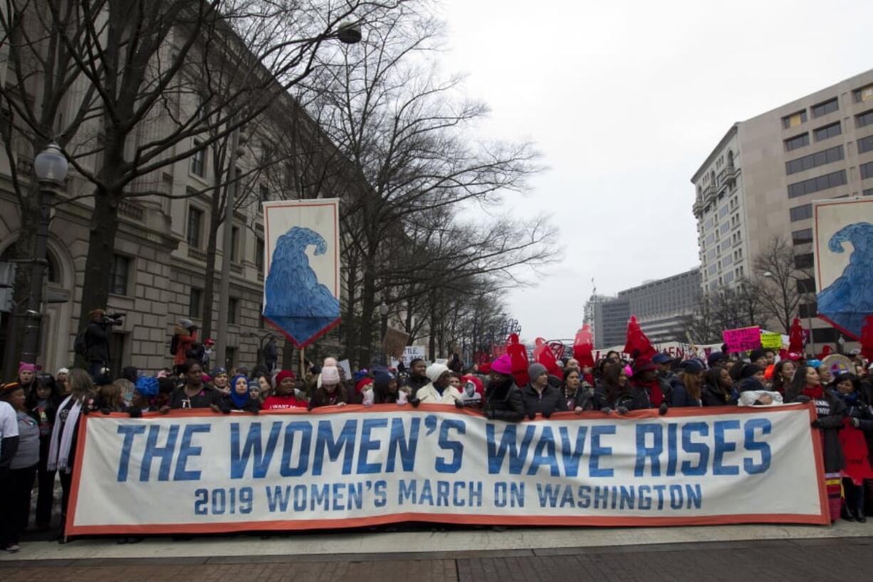 Demonstrators march on Pennsylvania Av. during the women’s march in Washington on Saturday, Jan. 19, 2019.