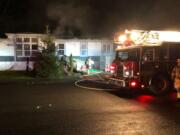 Clark County Fire & Rescue firefighters were called to this home near the corner of Sycamore Street and Heartwood Drive around 6 p.m. Thursday. Grease heated on a stove top ignited a fire that spread through its kitchen.