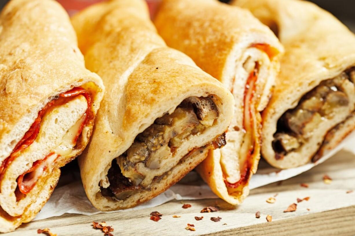 A close relative of pizza, stromboli is made, essentially, by rolling up an unbaked pizza like a log, tucking in the ends as you go.