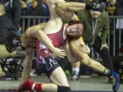 Camas' Tanner Craig grabs the legs of his Tahoma opponent, Steele Starren, during their 138-pound semifinals match on Saturday, Feb. 16, 2019, at the Mat Classic XXXI Championships held in the Tacoma Dome. Craig defeated Starren 5-3 in overtime.