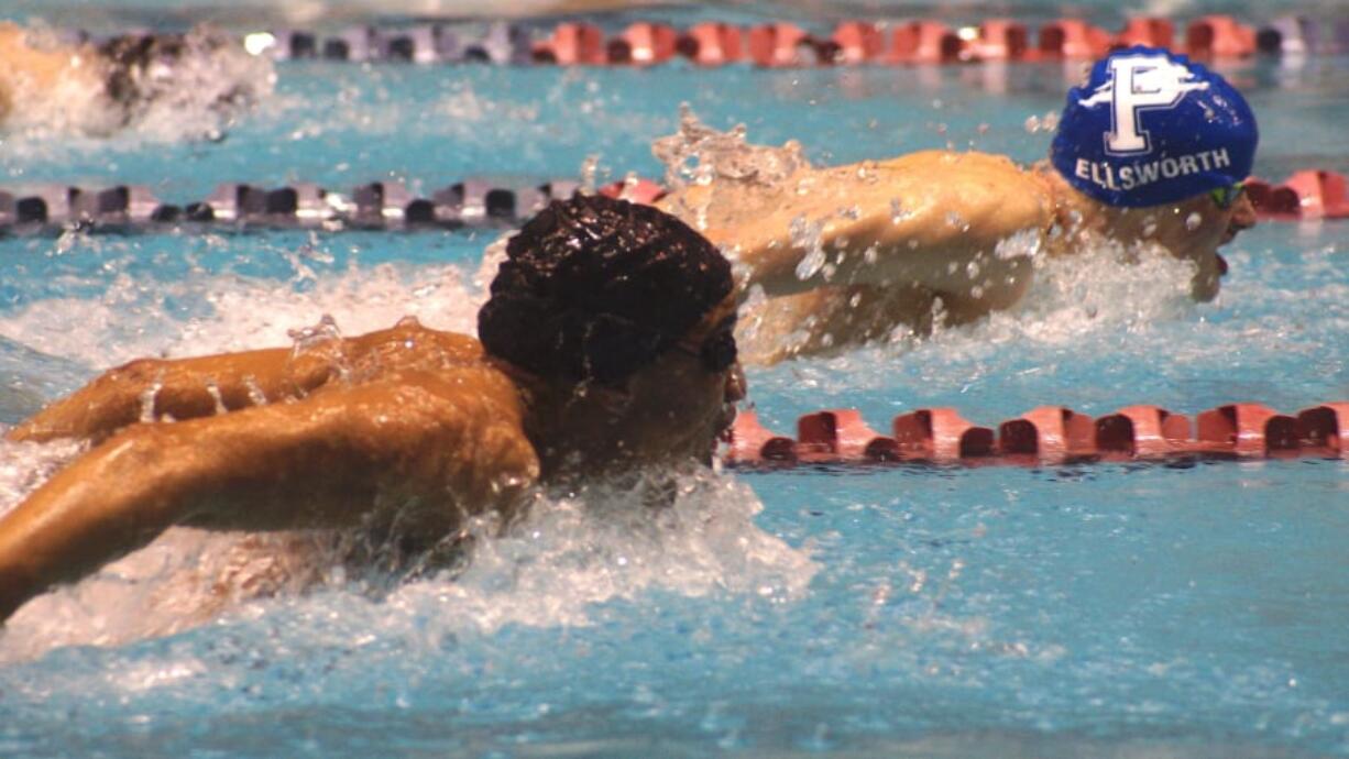 Isaiah Ross of Washougal (foreground) swims to a runner-up finish in the 100-yard butterfly to Holden Ellsworth of Pullman at the 2A state swim meet (Annette Griffus/For The Columbian)