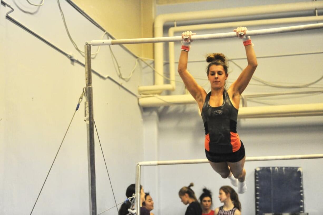 Camas sophomore Lili Ford practices her bars routine at Vancouver Elite Gymnastics Academy as the Papermakers prepare for this weekend’s state gymnastics meet.