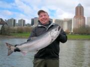 Darrel Ehl of Happy Valley, Ore., lifts a fine spring Chinook he caught while fishing with guide Bill Monroe Jr. on the Willamette River. With a short season possible on the Columbia, anglers would do well to try their luck in the Willamette this spring. Photos courtesy of Bill Monroe Jr.