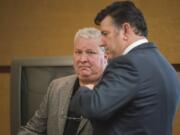 Mark A. Lugliani, left, appears for a plea hearing Jan. 24 in Clark County Superior Court.