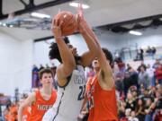 Alishawuan Taylor of Union drives to the basket in the Titans' win over Battle Ground (Ken Nowaczyk for The Columbian