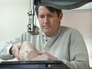 Decoy carver Dan Carson works on turning a chunk of wood into a finished but unpainted decoy in about two hours at his home studio on Jan. 2, 2019 in Havre de Grace, Md. (Kenneth K.