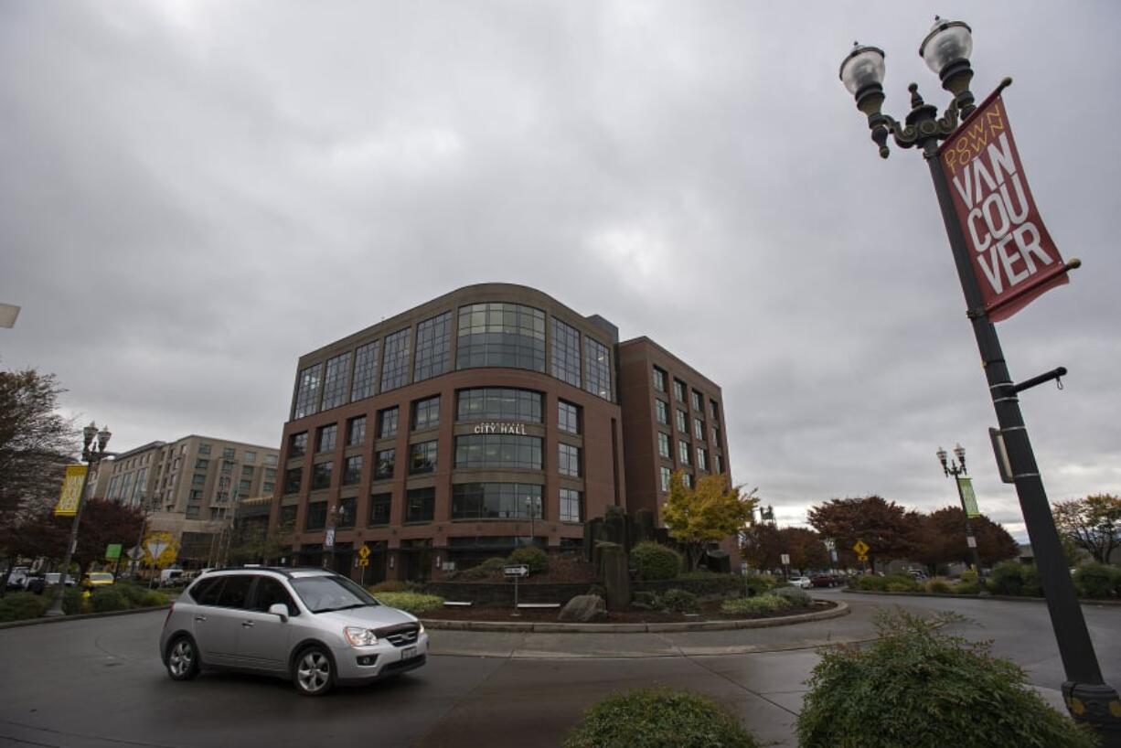 A motorist navigates the roundabout near Vancouver City Hall.