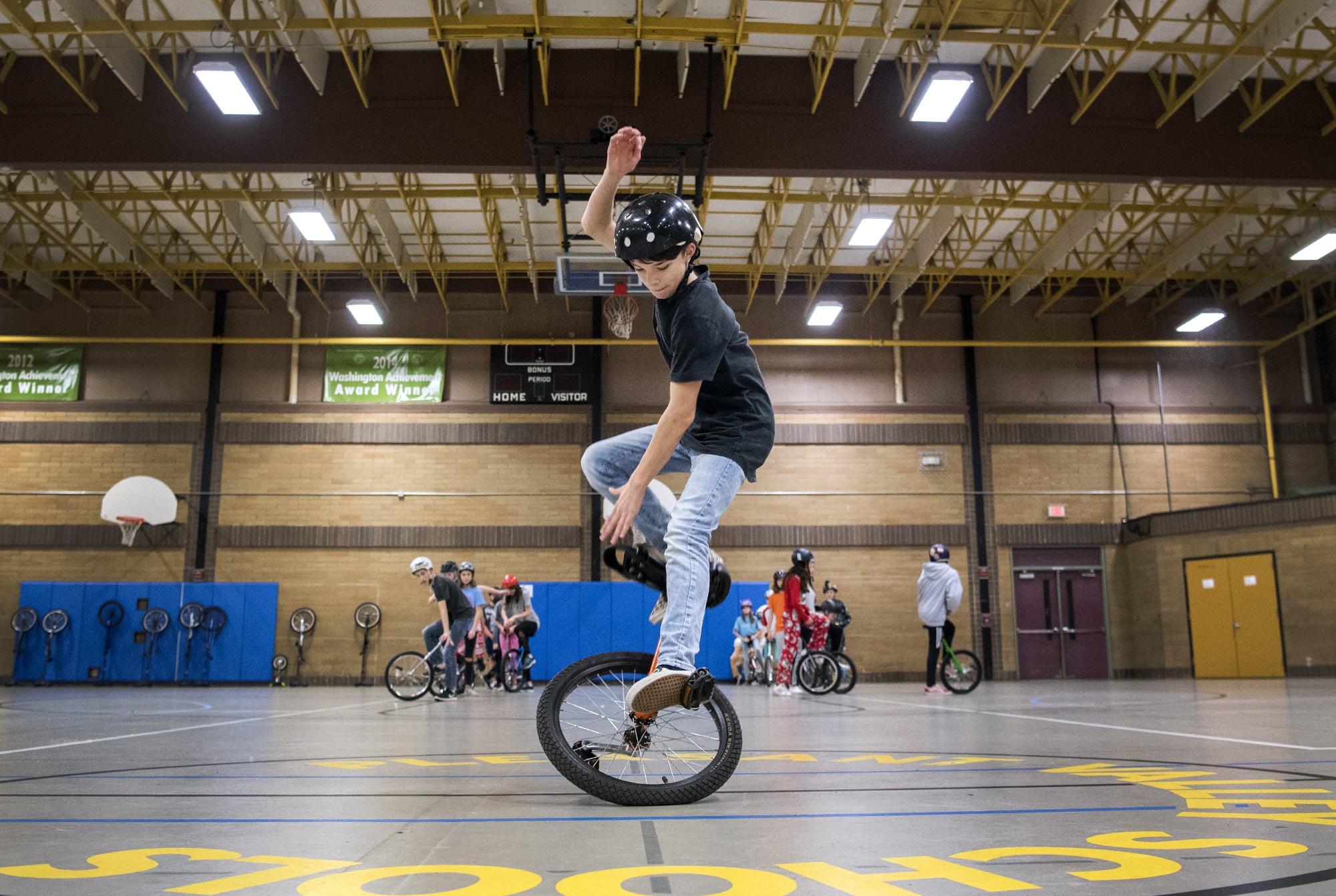 Pleasant Valley Middle School eighth-grader Chase Phillips completes a running, hands-free mount to start off the performance routine during practice at the school on Dec. 18, 2018. "I enjoy that not many people can do it," he said.