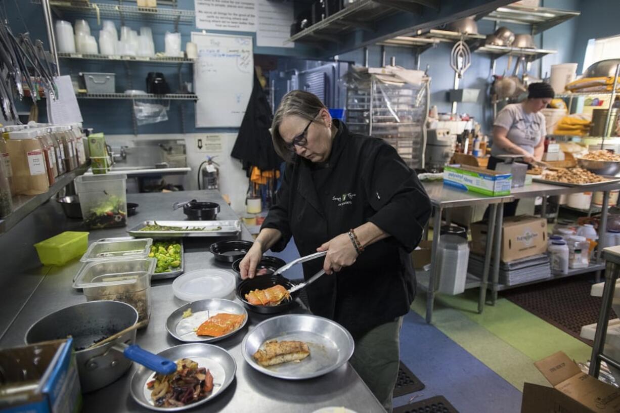 Tamara Leibfarth, owner and executive chef of Simply Thyme Catering, creates meals for a client. She hopes to add five to 10 staff members and pick up more clients this year. The business is the No. 1 catering company in Vancouver Business Journal’s Book of Lists, having completed 6,127 catering jobs in 2017.