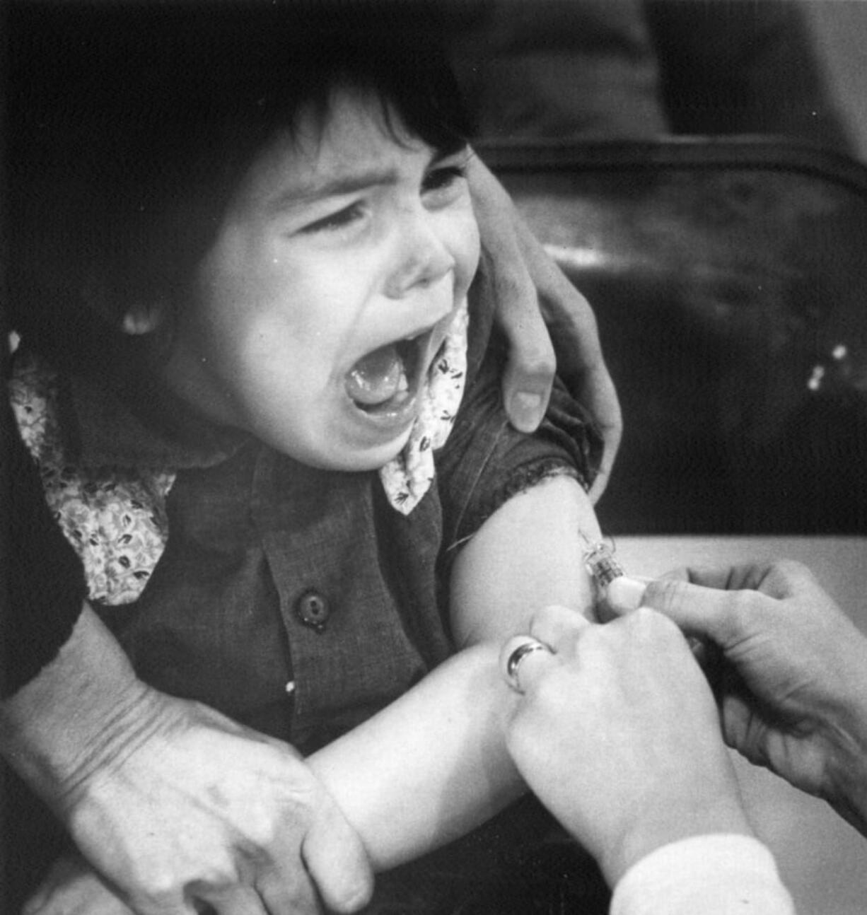 John Hernandez, 4, cries as he receives a measles vaccination on Jan. 22, 1977, during an outbreak. Once the measles vaccination was introduced to the general public in 1963, outbreaks shrank in size and frequency until the year 2000 when it was declared eradicated in the United States.