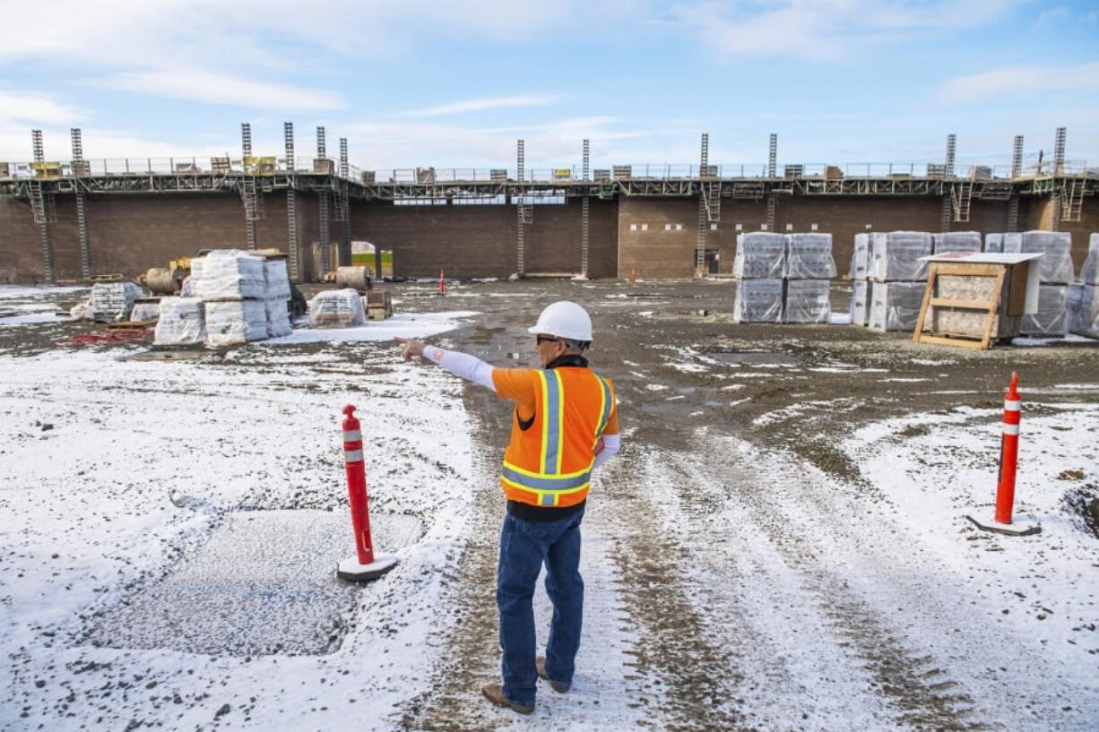 Dean Maldonado, owner of FDM Development, leads a tour on the site of the new Rosauers Supermarket in Ridgefield. Along with the grocery store, Maldonado agreed to make upgrades to Pioneer Street and Royle Road. As Ridgefield continues to grow, the city leverages credits to have developers help improve the city’s infrastructure.