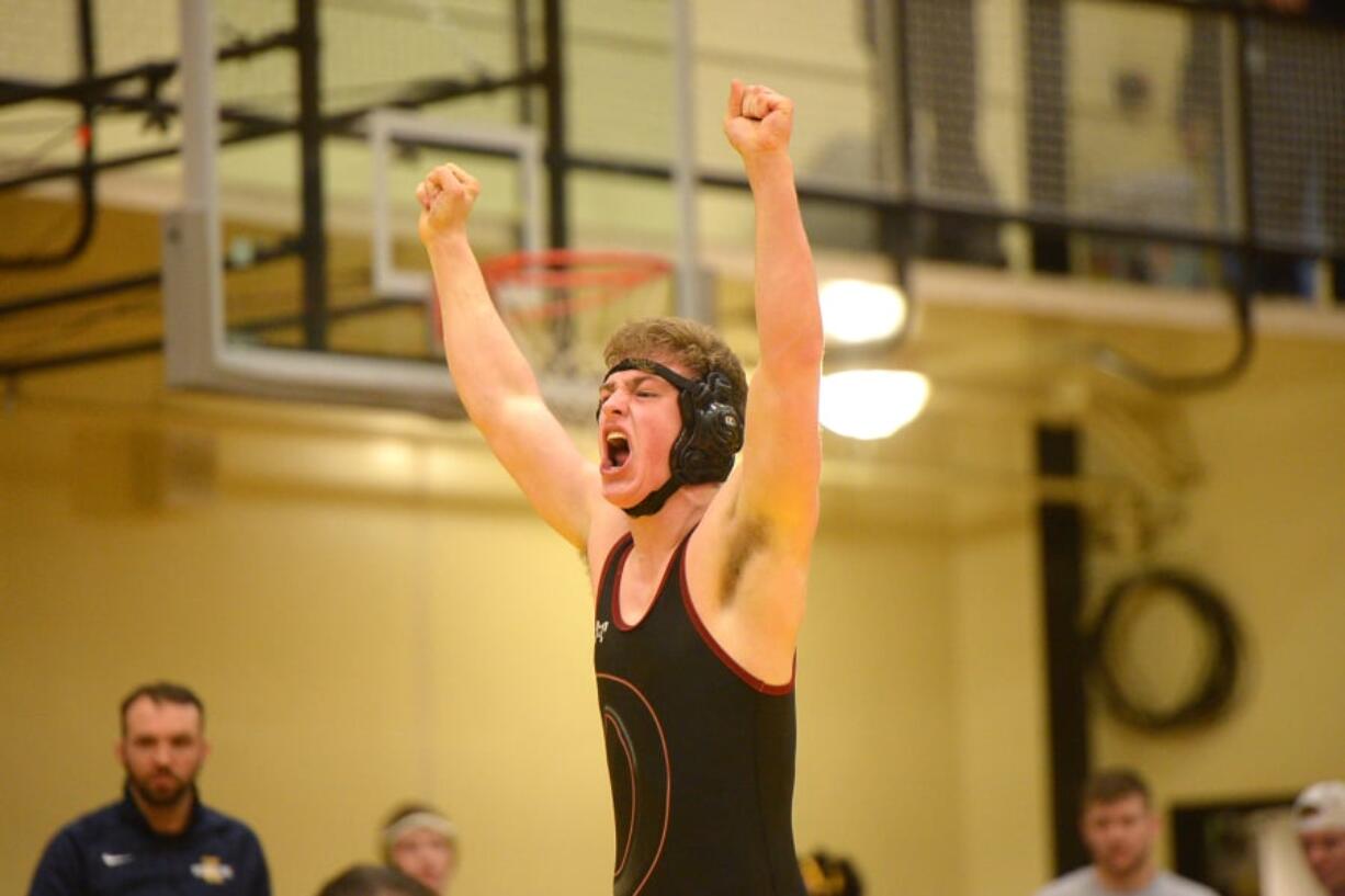 Prairie’s Nicholas Langer celebrates his victory over Kelso’s Blake Fowler in the 182-pound weight class.