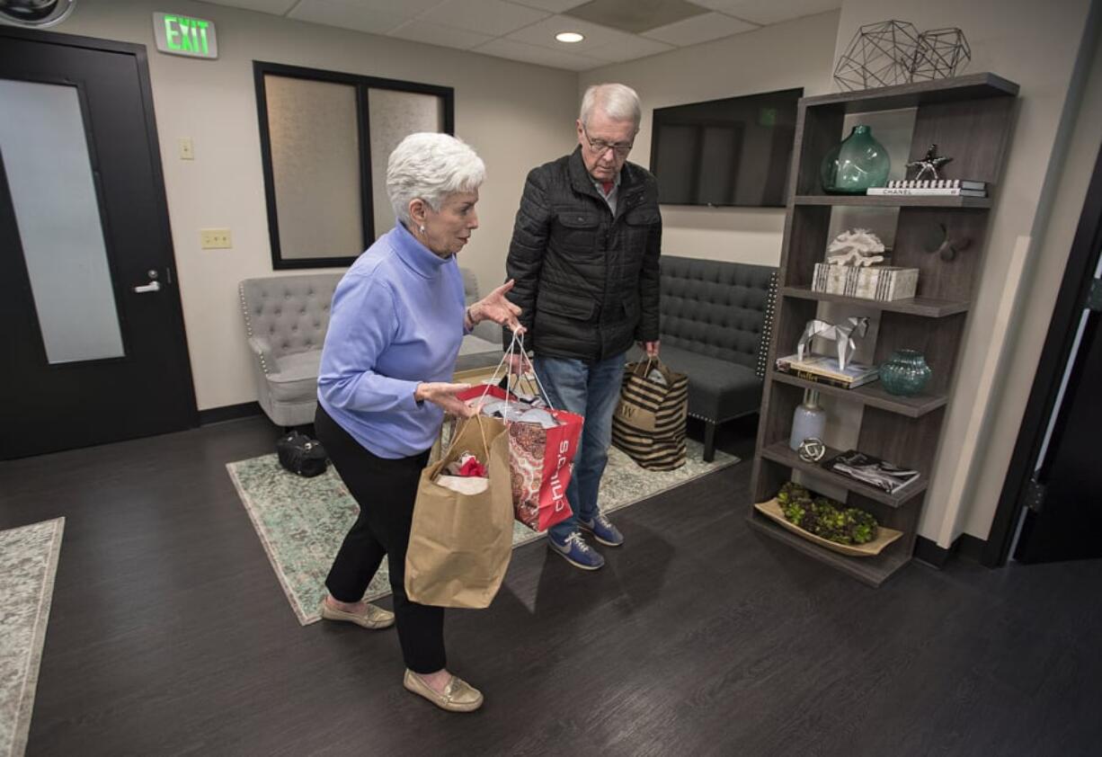 Mary Frances Duggan of Vancouver, who has battled breast cancer, joins her husband, Dennis, as they drop off 200 bras at Dr. Allen Gabriel’s office in Vancouver. Duggan collected 250 bras total, and they will go to The Gift of Lift, which helps women who are survivors of domestic violence, sex trafficking, low income, homeless or incarcerated.