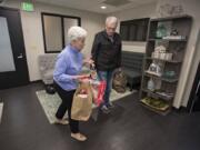 Mary Frances Duggan of Vancouver, who has battled breast cancer, joins her husband, Dennis, as they drop off 200 bras at Dr. Allen Gabriel’s office in Vancouver. Duggan collected 250 bras total, and they will go to The Gift of Lift, which helps women who are survivors of domestic violence, sex trafficking, low income, homeless or incarcerated.