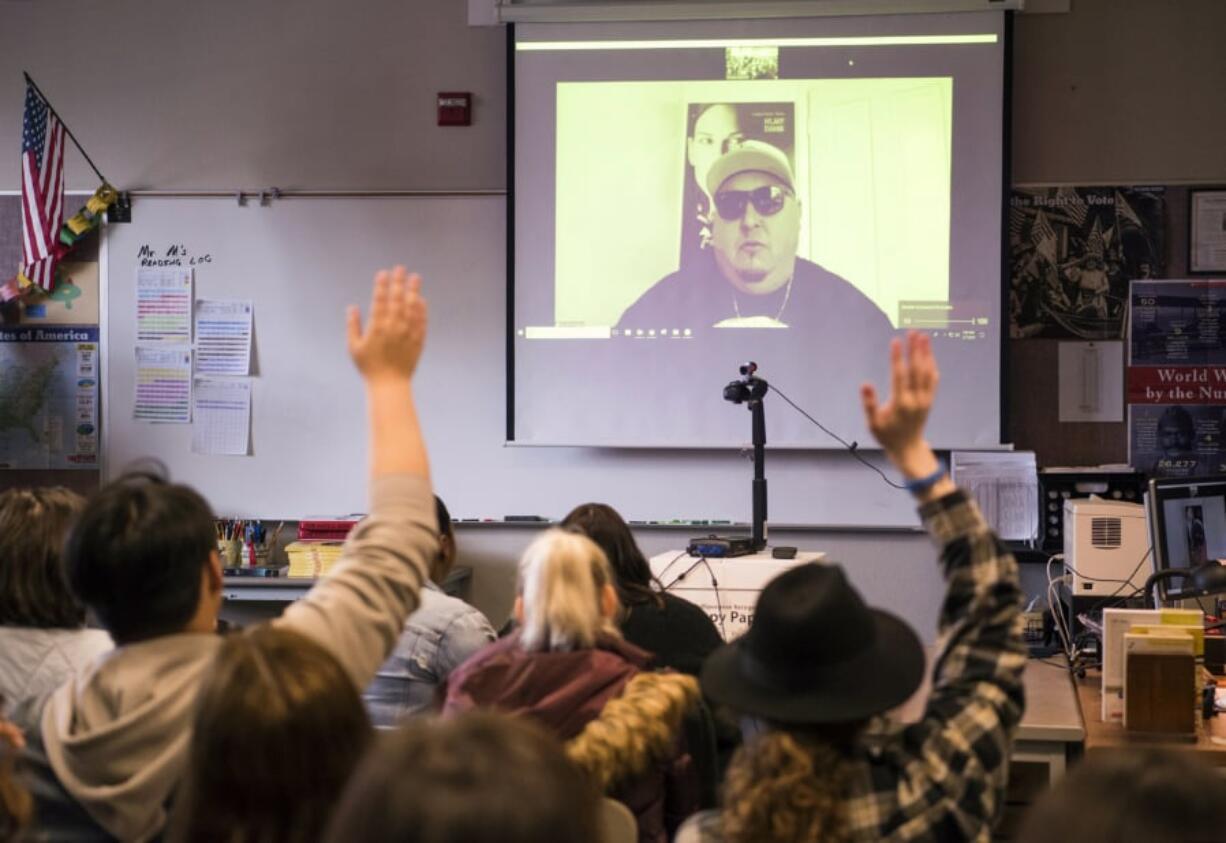 Freedom Writer Carlos Barragan video chats with Heritage High School students Thursday morning. He encouraged the students to work hard in school, take risks to better their lives and appreciate their teachers.