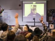 Freedom Writer Carlos Barragan video chats with Heritage High School students Thursday morning. He encouraged the students to work hard in school, take risks to better their lives and appreciate their teachers.