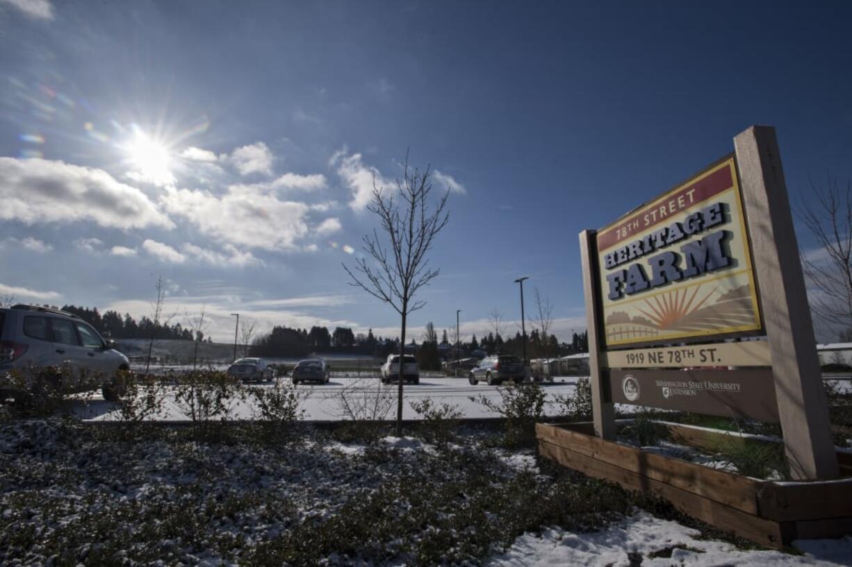 Winter sun illuminates the sign Tuesday morning at the 78th Street Heritage Farm, which is upgrading its outdated master plan and soliciting advice from the community about how it should operate in the future.