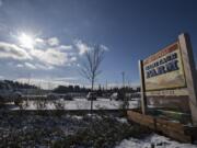 Winter sun illuminates the sign Tuesday morning at the 78th Street Heritage Farm, which is upgrading its outdated master plan and soliciting advice from the community about how it should operate in the future.