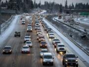 Southbound motorists move slowly along a slick Interstate 205 on Tuesday morning, Feb. 5, 2019 after snow blanketed the area overnight.