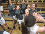 The Hudson's Bay Eagles celebrate their victory over Capital at Hudson's Bay High School on Thursday night, Feb. 7, 2019.