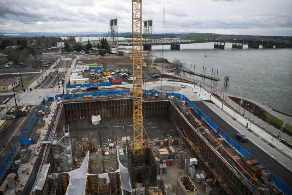 A conference room in The Murdock offers a close-up view of a hotel and condominium building under construction next door.