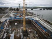 A conference room in The Murdock offers a close-up view of a hotel and condominium building under construction next door.