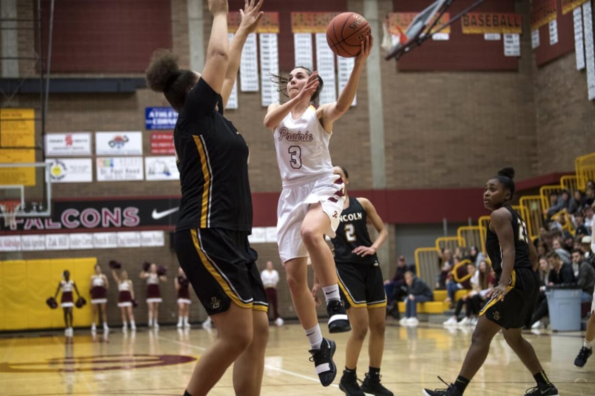 Prairie's Meri Dunford drives to the hoop against Lincoln defenders during a game at Prairie High School on Wednesday night, ThursdayFeb. 13, 2019.