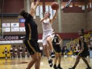 Prairie's Meri Dunford drives to the hoop against Lincoln defenders during a game at Prairie High School on Wednesday night, ThursdayFeb. 13, 2019.