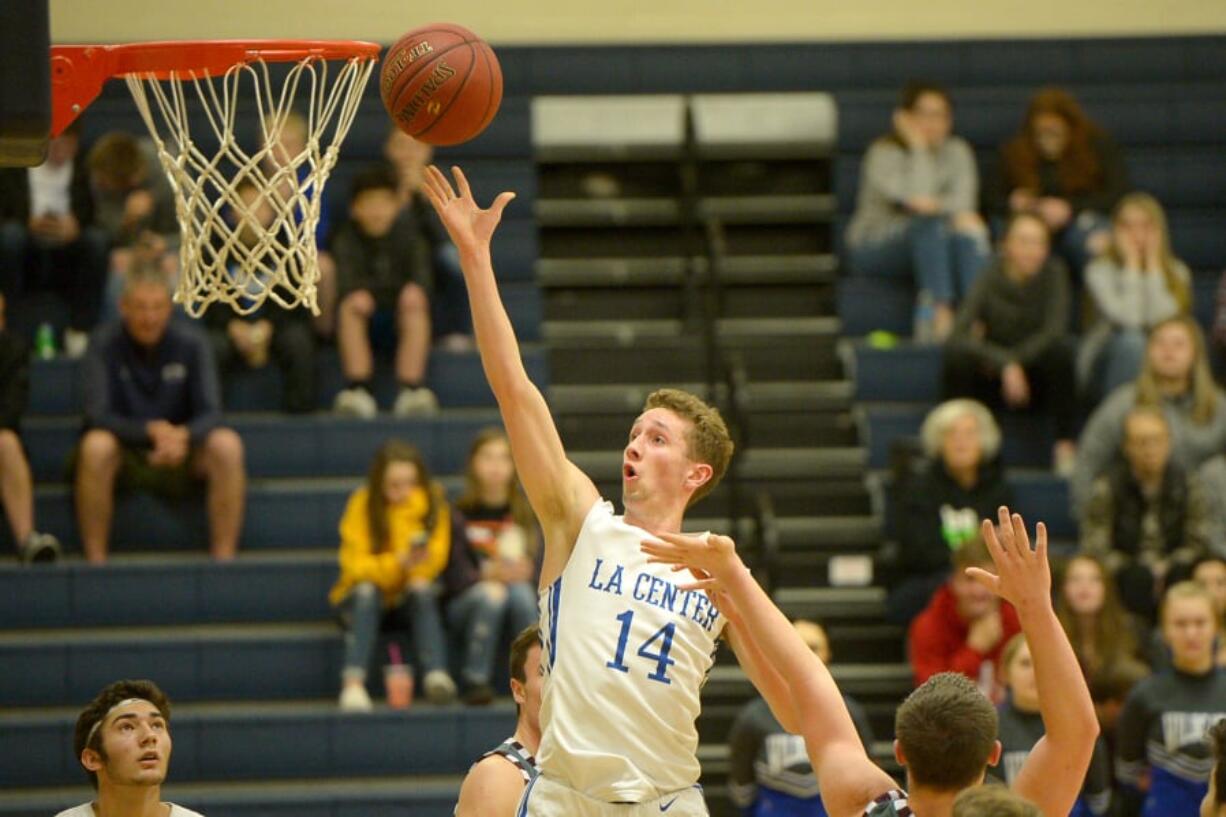 La Center’s Matt Bryant goes to the basket for two of his 20 points against Montesano on Tuesday in the 1A district semifinal game at King’s Way Christian High School. La Center won 80-69 to clinch a berth to state.