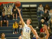 La Center’s Matt Bryant goes to the basket for two of his 20 points against Montesano on Tuesday in the 1A district semifinal game at King’s Way Christian High School. La Center won 80-69 to clinch a berth to state.