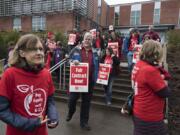 Clark College faculty and supporters prepare to make their way across campus during a rally for higher wages Feb. 13, 2019.